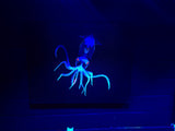 Baby Squid.  Photo on canvas with fluorescent highlights